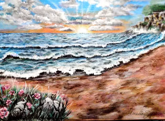 Waves rolling onto a sandy beach under a sunrise, with pink flowers in the foreground.